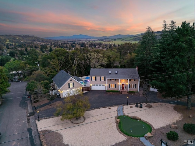 aerial view at dusk with a mountain view