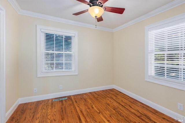 unfurnished room with wood-type flooring, ceiling fan, and crown molding