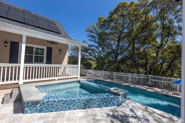 view of swimming pool with an in ground hot tub and a patio area