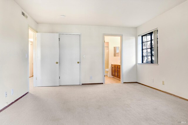 bathroom with walk in shower, vanity, and toilet