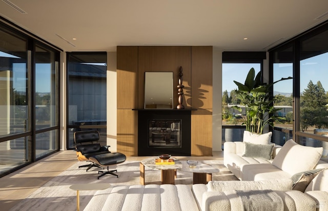 sunroom / solarium with a fireplace