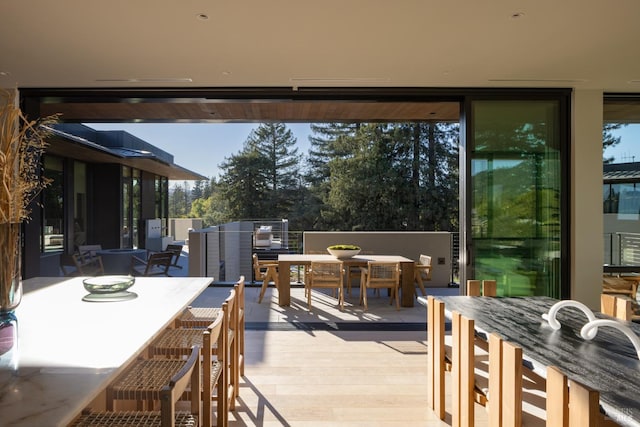 view of patio / terrace with a wooden deck and outdoor dining area