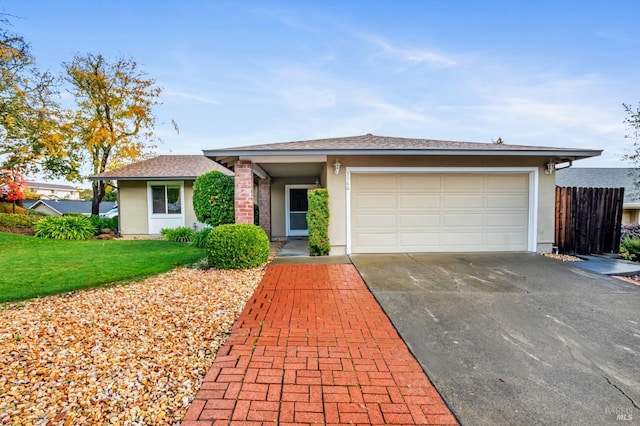 view of front of house featuring a garage and a front yard