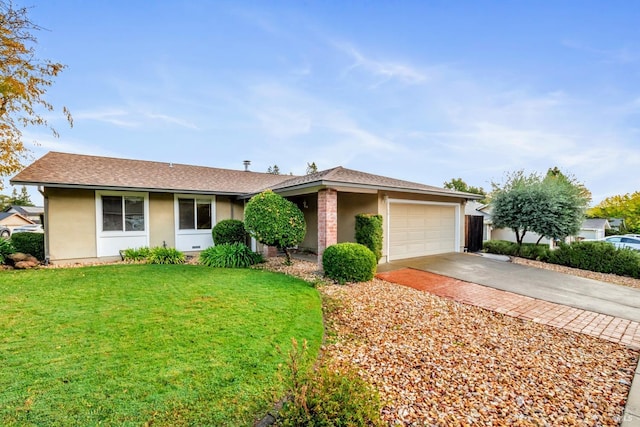 single story home featuring a garage and a front lawn