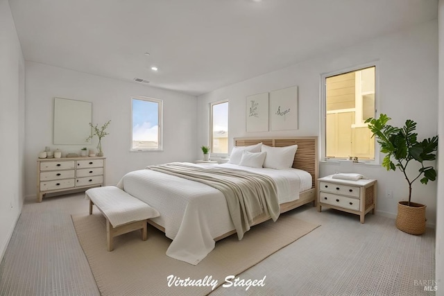 bedroom featuring light colored carpet