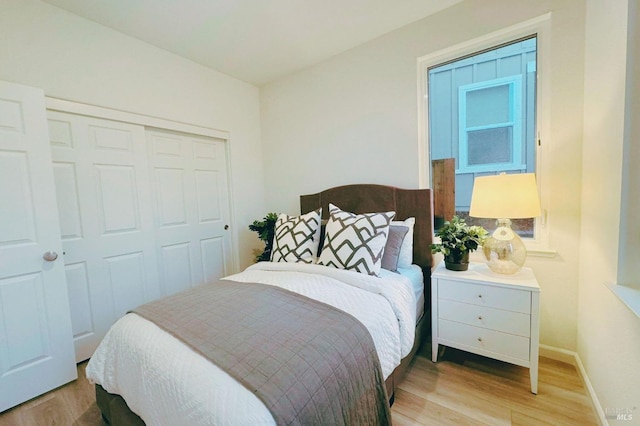 bedroom featuring a closet and light hardwood / wood-style floors