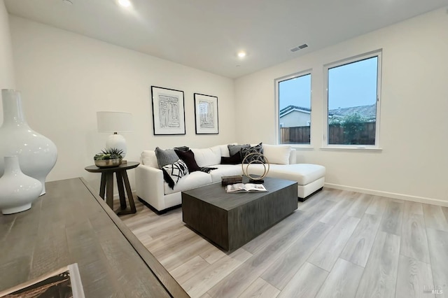 living room with light hardwood / wood-style floors