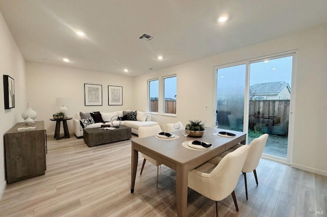 dining room with light wood-type flooring