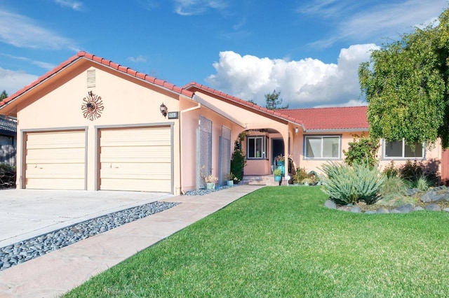 view of front of home featuring a front yard and a garage