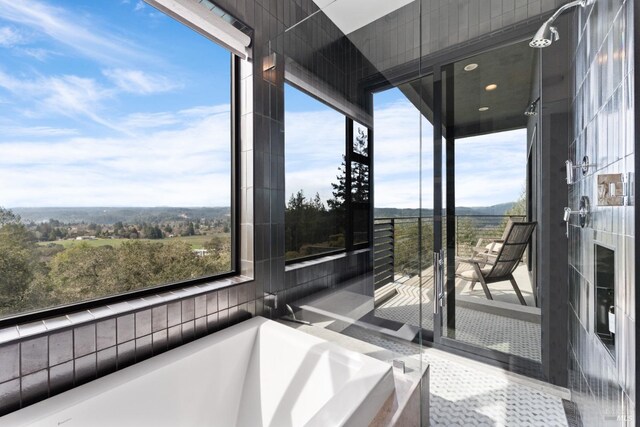 bathroom with shower with separate bathtub, vanity, and tile patterned floors