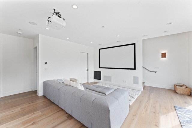 cinema featuring light hardwood / wood-style flooring