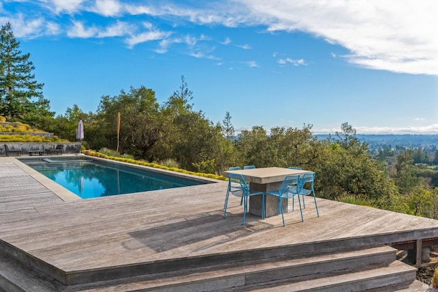 view of pool featuring a wooden deck