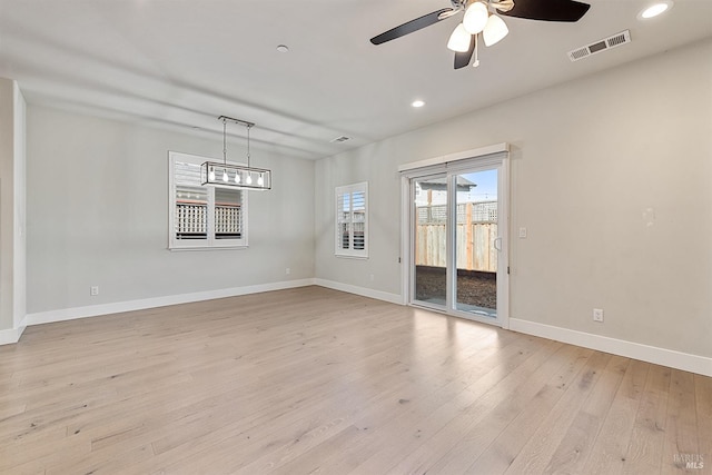 interior space featuring light wood-style flooring, visible vents, baseboards, and recessed lighting