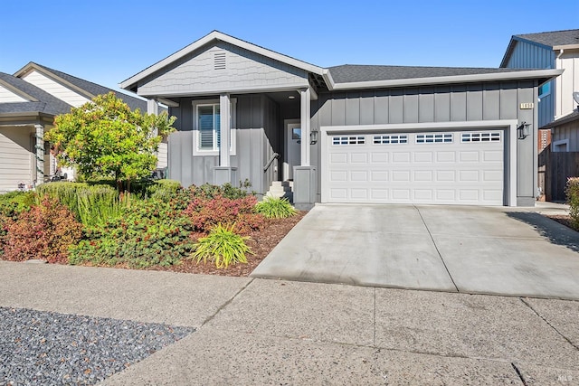 view of front of property with a garage, concrete driveway, and board and batten siding