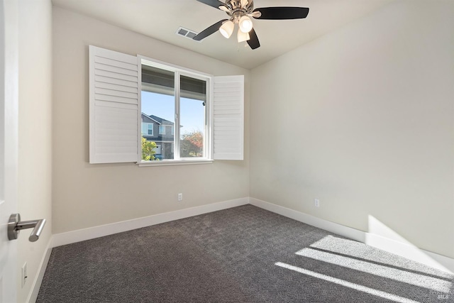 carpeted empty room with ceiling fan, visible vents, and baseboards