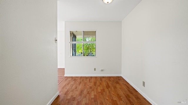 spare room featuring light wood-type flooring