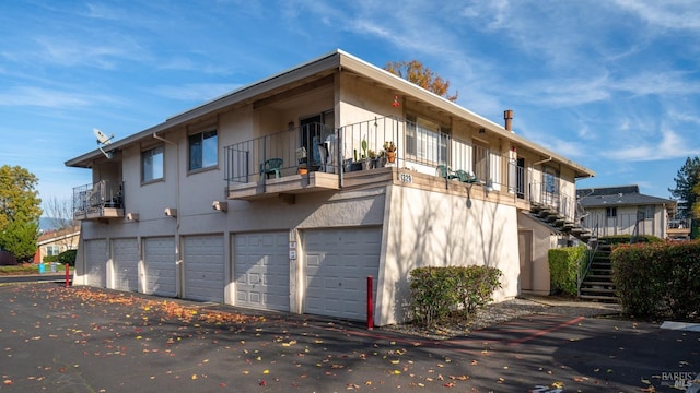 rear view of property with a garage