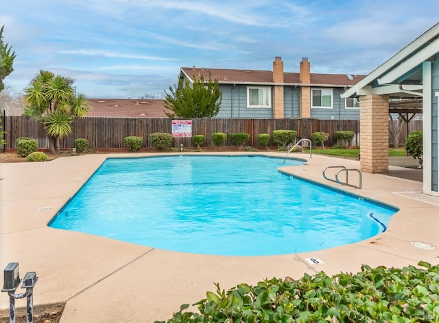 view of swimming pool featuring a patio