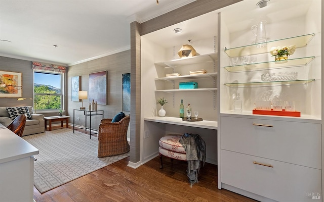 interior space with hardwood / wood-style flooring and ornamental molding