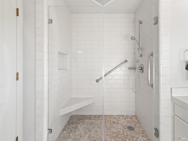 bathroom with a shower with shower door