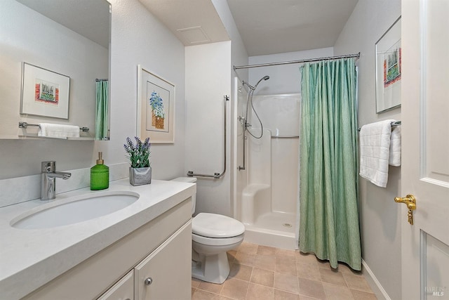 bathroom featuring toilet, vanity, curtained shower, and tile patterned floors