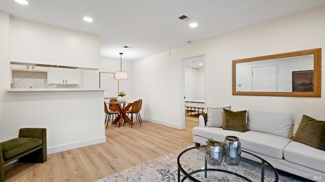 living room with light hardwood / wood-style flooring