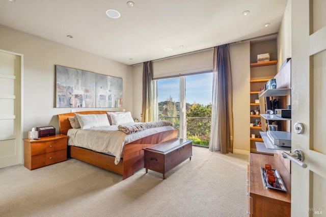 bedroom featuring light colored carpet