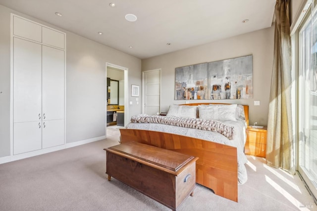 carpeted bedroom with ensuite bathroom