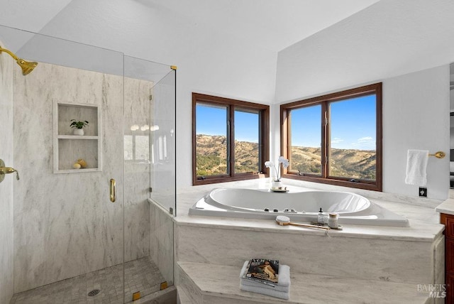 bathroom featuring a mountain view, shower with separate bathtub, and vanity