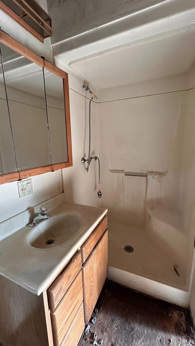 bathroom featuring vanity and walk in shower