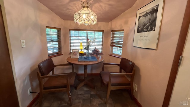 dining space with vaulted ceiling