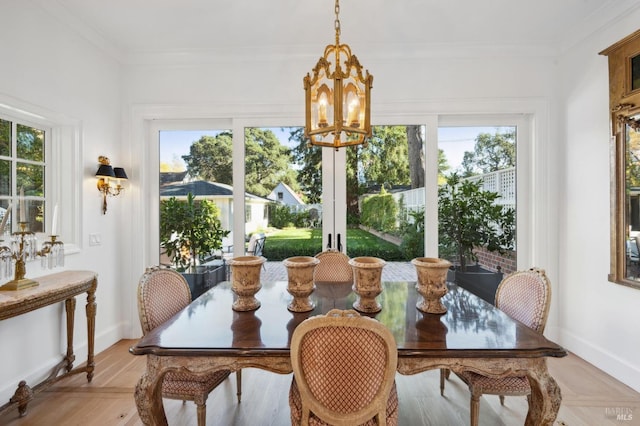 sunroom with an inviting chandelier