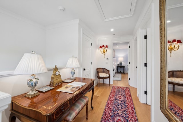 office with light hardwood / wood-style flooring and ornamental molding