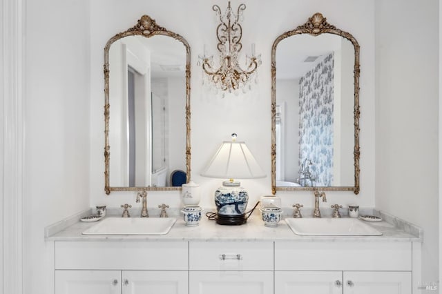 bathroom featuring vanity and an inviting chandelier