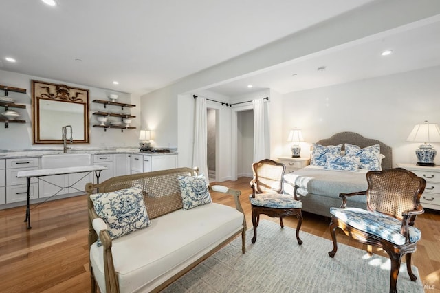 interior space featuring sink and light hardwood / wood-style flooring