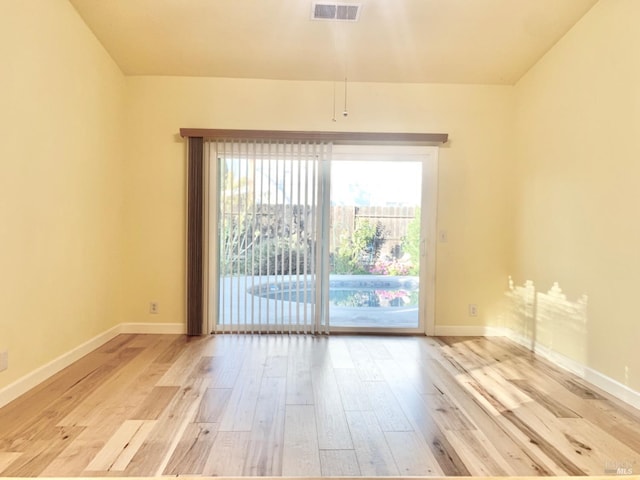 unfurnished room featuring light hardwood / wood-style floors