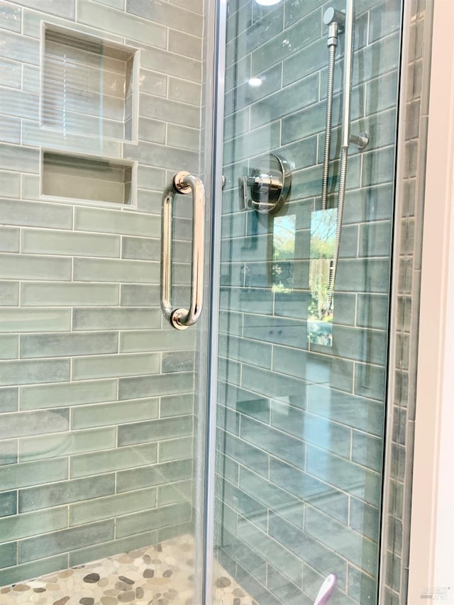 bathroom with an enclosed shower