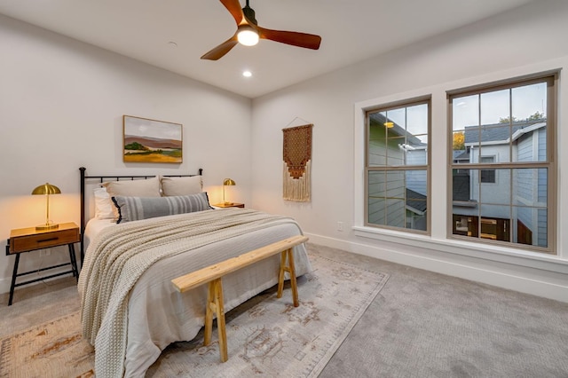 carpeted bedroom with ceiling fan