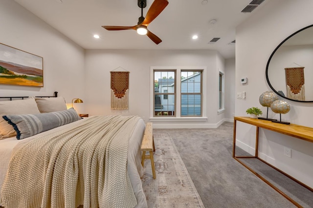 bedroom with ceiling fan and light colored carpet