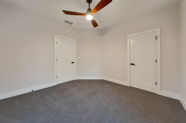 carpeted empty room with ceiling fan