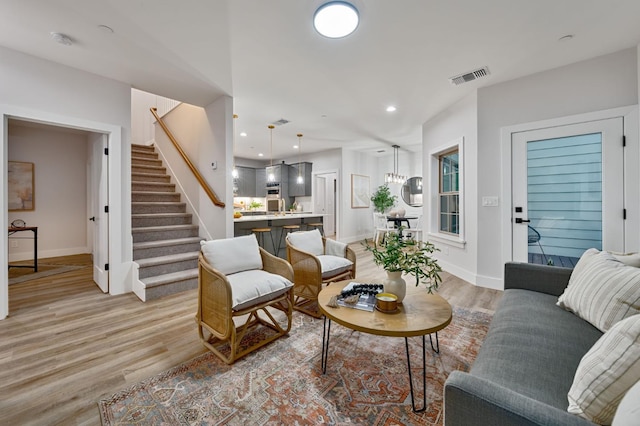 living room with light hardwood / wood-style floors