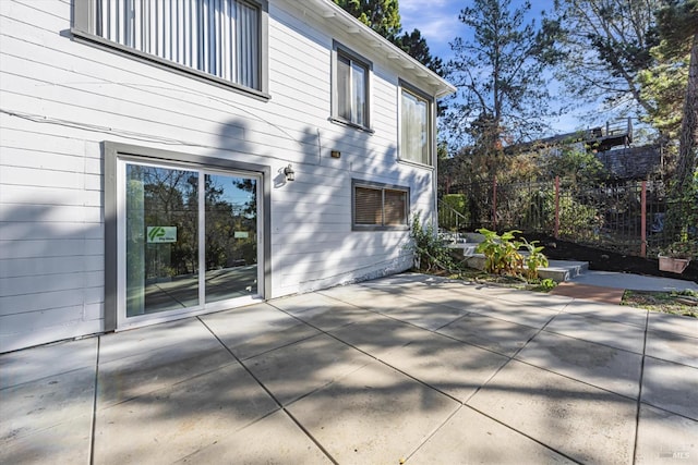 view of property exterior featuring a patio area