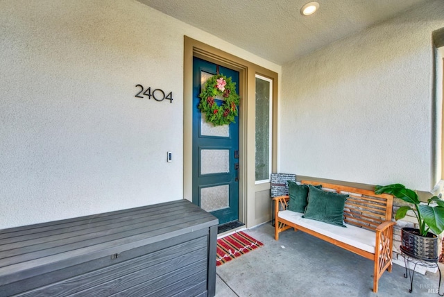 doorway to property with covered porch