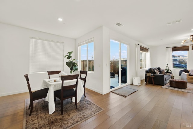 dining space featuring wood-type flooring