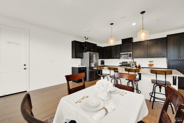 dining room with light hardwood / wood-style flooring