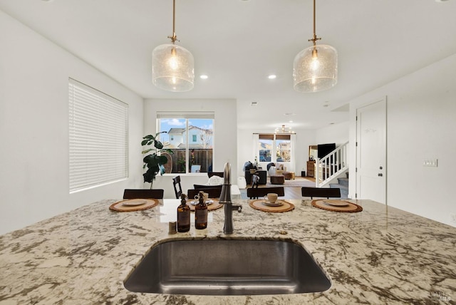 kitchen featuring sink and hanging light fixtures