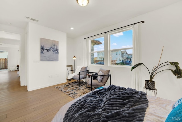 bedroom with wood-type flooring