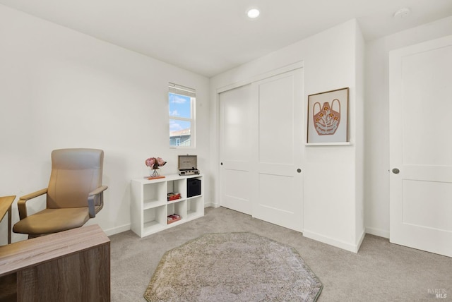 sitting room with light colored carpet