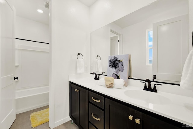 bathroom featuring tile patterned flooring and vanity