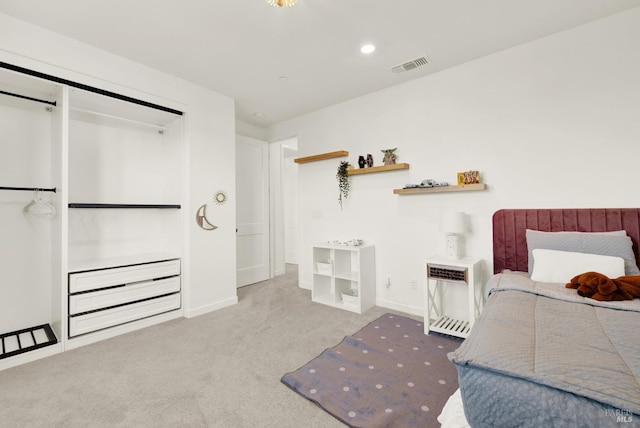 carpeted bedroom featuring heating unit